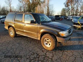 1997 Ford Explorer XL with VIN 1FMDU34E8VUC95969, listed as a Copart auction lot 83269784 with 174,035 mi miles and Salvage title. Bid and sale history available at DreamBid. Image 4.