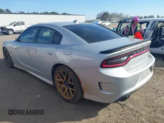 2019 Dodge Charger Scat Pack with VIN 2C3CDXGJXKH599632, listed as a IAAI auction lot 41666680 with 116,995 mi miles and . Bid and sale history available at DreamBid. Image 3.