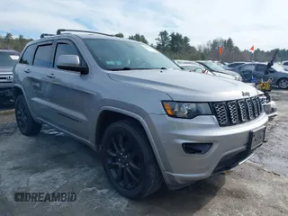 2018 Jeep Grand Cherokee Laredo E with VIN 1C4RJFAG1JC487082, listed as a IAAI auction lot 41663081 with 136,853 mi miles. Bid and sale history available at carsss.com. Image 1.