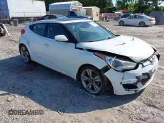 2013 Hyundai Veloster w/Gray Int with VIN KMHTC6AD3DU124542, listed as a IAAI auction lot 42332547 with 167,005 mi miles and . Bid and sale history available at DreamBid. Image 1.
