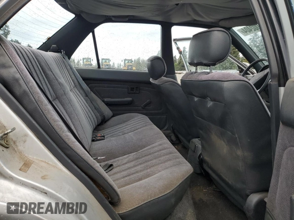 1991 Toyota Corolla z VIN 1NXAE94A8MZ234510, wystawiony jako Copart lot #75002404 z przebiegiem 188 051 mil mil oraz Szkoda całkowita • Salvage title. Historia ofert i sprzedaży dostępna na DreamBid. Obrazek 10.