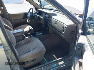 1994 Jeep Grand Cherokee Laredo with VIN 1J4GZ58S4RC325909, listed as a IAAI auction lot 39580601 with 162,952 mi miles. Bid and sale history available at carsss.com. Image 5.