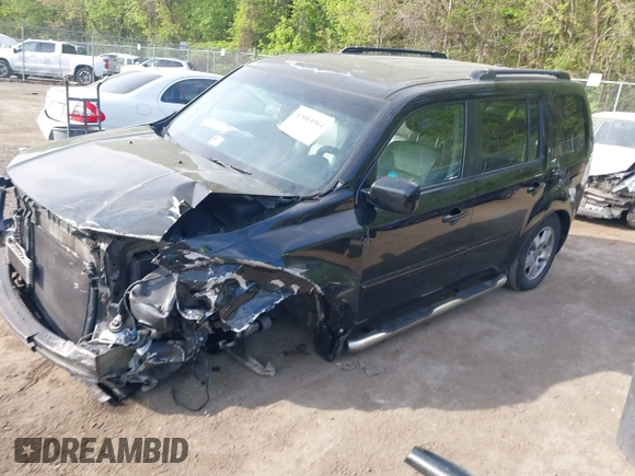 2011 Honda Pilot EX-L with VIN 5FNYF4H63BB004288, listed as a IAAI auction lot 42084984 with 215,019 mi miles and . Bid and sale history available at carsss.com. Image 2.