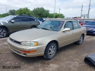1996 Toyota Camry DX with VIN 4T1BG12K7TU781388, listed as a IAAI auction lot 42089118 with 196,988 mi miles. Bid and sale history available at carsss.com. Image 2.