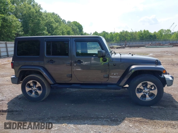 2016 Jeep Wrangler Unlimited Sahara with VIN 1C4BJWEG7GL340074, listed as a IAAI auction lot 42434763 with 81,095 mi miles and . Bid and sale history available at DreamBid. Image 13.