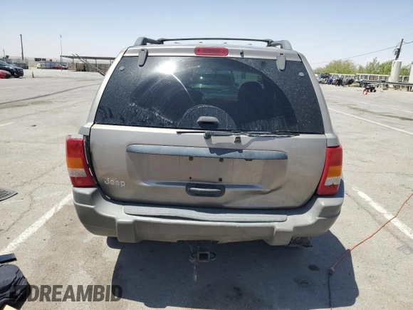1999 Jeep Grand Cherokee Laredo with VIN 1J4GW58S1XC775877, listed as a Copart auction lot 55639795 with 197,611 mi miles and Salvage title. Bid and sale history available at DreamBid. Image 6.