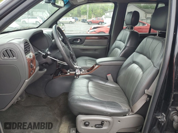 2004 GMC Envoy SLT with VIN 1GKDT13S842210243, listed as a Copart auction lot 55672595 with 148,232 mi miles and Clean Title. Bid and sale history available at DreamBid. Image 7.