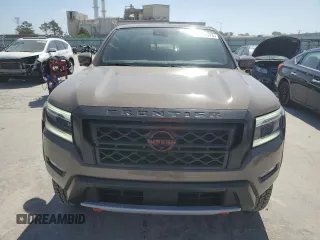 2023 Nissan Frontier Pro-4X with VIN 1N6ED1EK0PN668109, listed as a Copart auction lot 57064975 with 6,406 mi miles and Salvage title. Bid and sale history available at DreamBid. Image 5.