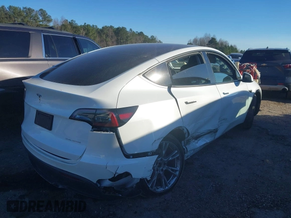 2023 Tesla Model Y Long Range with VIN 7SAYGAEE3PF753657, listed as a IAAI auction lot 41668917 with 33,301 mi miles and . Bid and sale history available at DreamBid. Image 4.
