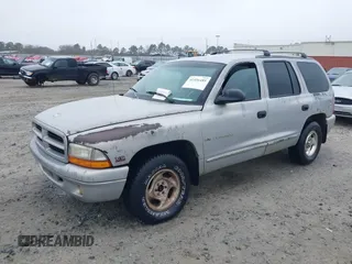 1999 Dodge Durango with VIN 1B4HR28YXXF517034, listed as a IAAI auction lot 41556485 with 208,998 mi miles and . Bid and sale history available at DreamBid. Image 2.