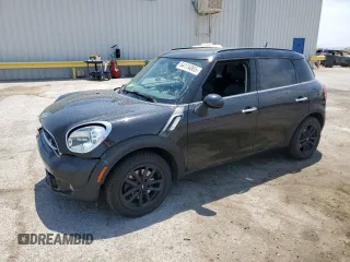2016 MINI Countryman S with VIN WMWZC3C59GWT10479, listed as a Copart auction lot 64174065 with 67,585 mi miles and Salvage title. Bid and sale history available at DreamBid. Image 1.