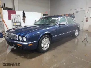 2002 Jaguar XJ VDP with VIN SAJDA24C92LF40385, listed as a Copart auction lot 82323214 with 100,999 mi miles and Salvage Title. Bid and sale history available at carsss.com. Image 1.