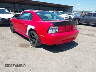 2004 Ford Mustang GT Deluxe z VIN 1FAFP42XX4F210024, wystawiony jako IAAI lot #42119586 z przebiegiem 176 164 mil mil oraz . Historia ofert i sprzedaży dostępna na DreamBid. Obrazek 3.