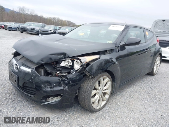 2012 Hyundai Veloster w/Gray Int z VIN KMHTC6AD6CU054422, wystawiony jako IAAI lot #41930634 z przebiegiem 144 681 mil mil oraz . Historia ofert i sprzedaży dostępna na DreamBid. Obrazek 6.