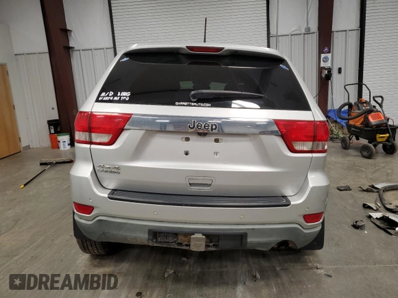 2011 Jeep Grand Cherokee Laredo z VIN 1J4RR4GGXBC609891, wystawiony jako Copart lot #52089645 z przebiegiem 180 895 mil mil oraz Szkoda całkowita • Salvage title. Historia ofert i sprzedaży dostępna na DreamBid. Obrazek 6.