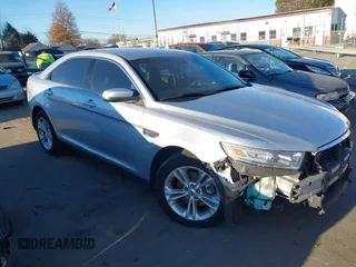 2014 Ford Taurus SEL z VIN 1FAHP2E87EG121069, wystawiony jako IAAI lot #41030422 z przebiegiem 138 043 mil mil oraz . Historia ofert i sprzedaży dostępna na DreamBid. Obrazek 1.