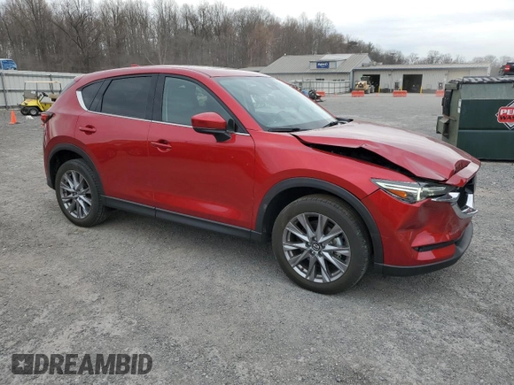 2021 Mazda CX-5 Grand Touring Reserve with VIN JM3KFBAY3M0315640, listed as a Copart auction lot 51004955 with 21,981 mi miles and Salvage Title. Bid and sale history available at DreamBid. Image 4.