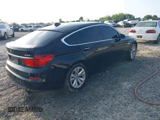 2013 BMW 5 Series GT 535i xDrive with VIN WBASP2C50DC338989, listed as a IAAI auction lot 42041585 with 121,429 mi miles. Bid and sale history available at carsss.com. Image 4.