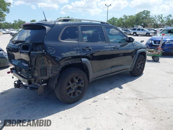 2017 Jeep Cherokee Trailhawk with VIN 1C4PJMBS9HW537962, listed as a IAAI auction lot 42002460 with 129,037 mi miles and . Bid and sale history available at DreamBid. Image 4.