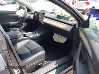 2023 Tesla Model 3 with VIN 5YJ3E1EA0PF518904, listed as a IAAI auction lot 42058540 with 20,945 mi miles and . Bid and sale history available at DreamBid. Image 5.