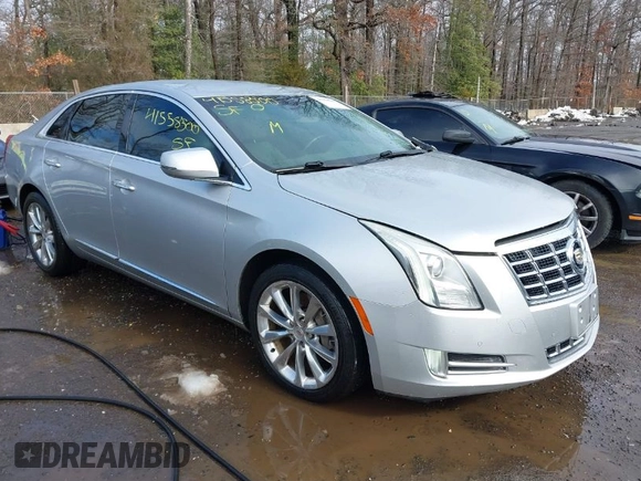 2013 Cadillac XTS Premium with VIN 2G61S5S36D9111444, listed as a IAAI auction lot 41558500 with 101,223 mi miles. Bid and sale history available at carsss.com. Image 1.