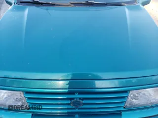 1995 Suzuki Sidekick z VIN 2S3TA02C3S6414337, wystawiony jako Copart lot #86304134 z przebiegiem 104 889 mil mil oraz Szkody całkowita. Historia ofert i sprzedaży dostępna na DreamBid. Obrazek 11.