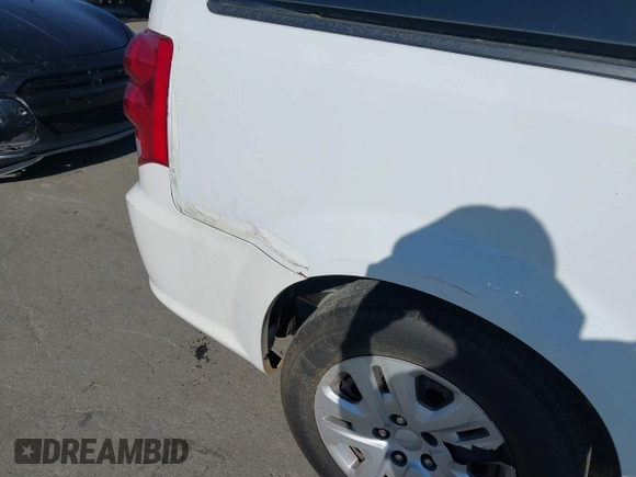 2015 Dodge Grand Caravan SE with VIN 2C4RDGBGXFR569435, listed as a IAAI auction lot 42057084 with 160,058 mi miles and . Bid and sale history available at DreamBid. Image 6.