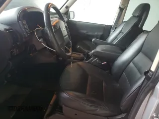 2004 Land Rover Discovery SE z VIN SALTW19404A850159, wystawiony jako Copart lot #51779445 z przebiegiem 166 321 mil mil oraz Szkoda całkowita • Salvage title. Historia ofert i sprzedaży dostępna na DreamBid. Obrazek 7.