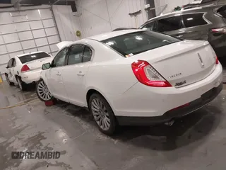 2014 Lincoln MKS with VIN 1LNHL9EK5EG605750, listed as a IAAI auction lot 41565308 with 167,835 mi miles. Bid and sale history available at carsss.com. Image 3.