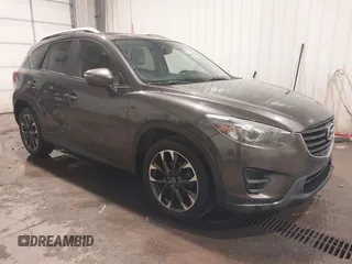 2016 Mazda CX-5 Grand Touring with VIN JM3KE4DY0G0732843, listed as a IAAI auction lot 41520889 with 149,798 mi miles. Bid and sale history available at carsss.com. Image 1.