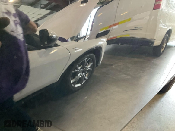 2022 Chevrolet Traverse LT with VIN 1GNERHKW8NJ150023, listed as a IAAI auction lot 42585752 with 102,823 mi miles and . Bid and sale history available at DreamBid. Image 14.