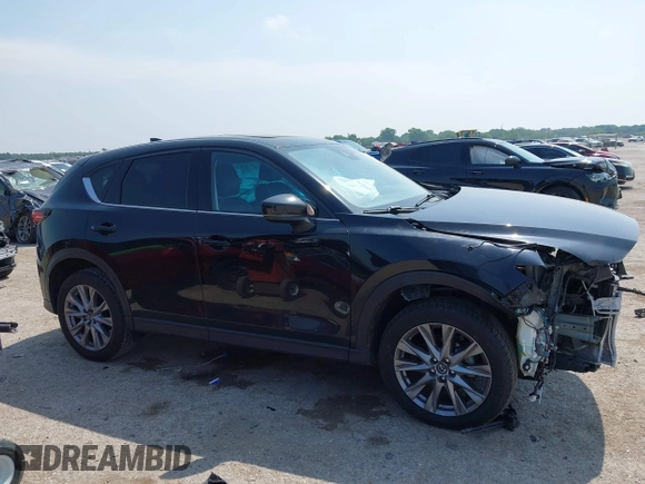 2020 Mazda CX-5 Grand Touring with VIN JM3KFADM1L0781634, listed as a IAAI auction lot 42333769 with 103,080 mi miles and . Bid and sale history available at DreamBid. Image 13.