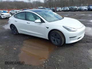2023 Tesla Model 3 z VIN 5YJ3E1EA8PF671613, wystawiony jako IAAI lot #41737438 z przebiegiem 21 405 mil mil oraz . Historia ofert i sprzedaży dostępna na DreamBid. Obrazek 1.