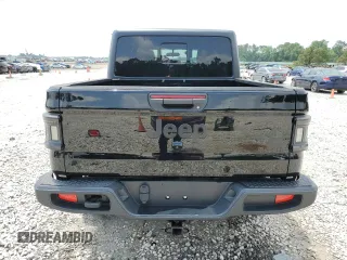 2023 Jeep Gladiator Sport S with VIN 1C6HJTAG9PL525183, listed as a Copart auction lot 54556735 with 13,805 mi miles and Salvage title. Bid and sale history available at DreamBid. Image 6.