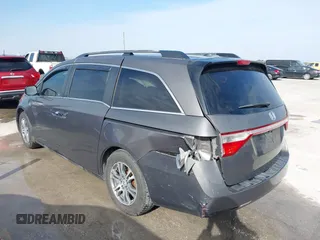2012 Honda Odyssey EX-L with VIN 5FNRL5H60CB094682, listed as a IAAI auction lot 41570797 with 127,890 mi miles and . Bid and sale history available at carsss.com. Image 3.