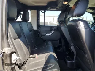 2014 Jeep Wrangler Unlimited Sahara z VIN 1C4BJWEG4EL164226, wystawiony jako Copart lot #53849355 z przebiegiem 82 145 mil mil oraz Szkoda całkowita • Salvage title. Historia ofert i sprzedaży dostępna na DreamBid. Obrazek 11.
