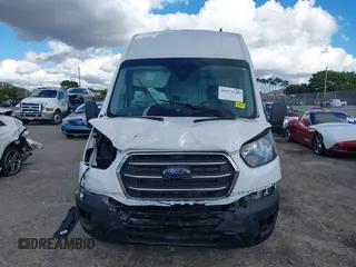 2021 Ford Transit Cargo with VIN 1FTBW3X8XMKA14051, listed as a IAAI auction lot 41672248 with 127,438 mi miles. Bid and sale history available at carsss.com. Image 13.