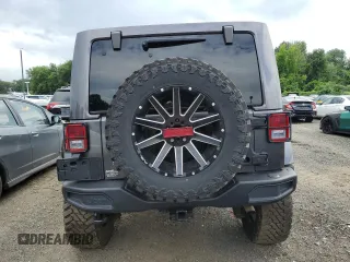 2018 Jeep Wrangler Unlimited Sahara with VIN 1C4BJWEG4JL822007, listed as a Copart auction lot 61450915 with 91,148 mi miles and Salvage title. Bid and sale history available at DreamBid. Image 6.