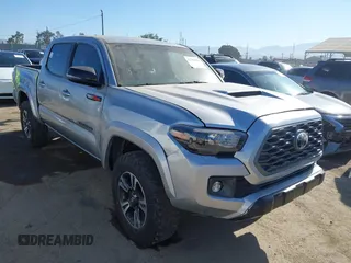 2023 Toyota Tacoma SR with VIN 3TMCZ5AN0PM538974, listed as a IAAI auction lot 42700653 with 31,281 mi miles and . Bid and sale history available at DreamBid. Image 1.