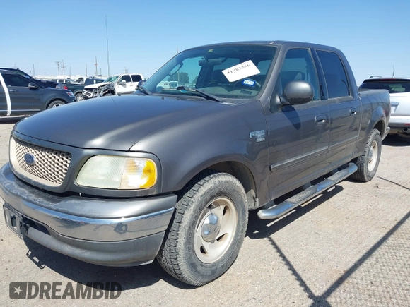 2003 Ford F-150 XLT with VIN 1FTRW07L63KA65904, listed as a IAAI auction lot 41983556 with 166,086 mi miles. Bid and sale history available at carsss.com. Image 2.