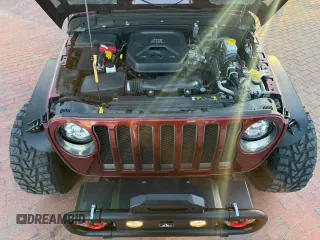 2021 Jeep Wrangler Unlimited Willys with VIN 1C4HJXDNXMW680247, listed as a Copart auction lot 57000145 with 77,407 mi miles and Clean Title. Bid and sale history available at DreamBid. Image 7.