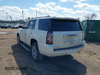 2015 GMC Yukon Denali with VIN 1GKS1CKJ5FR285199, listed as a IAAI auction lot 41763187 with 135,265 mi miles. Bid and sale history available at carsss.com. Image 3.