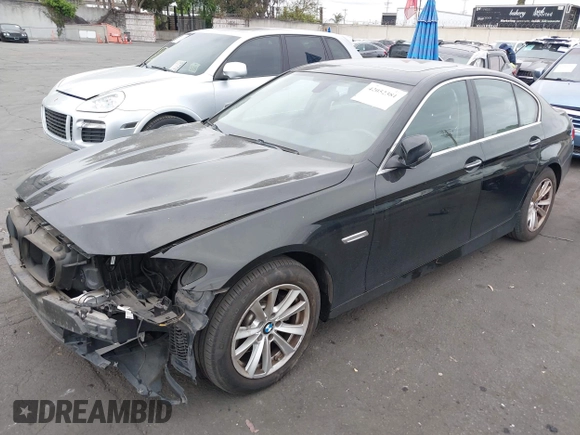 2015 BMW 5 Series 528i with VIN WBA5A5C56FD514814, listed as a IAAI auction lot 42052381 with 76,306 mi miles. Bid and sale history available at carsss.com. Image 2.