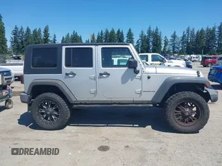 2008 Jeep Wrangler Unlimited X with VIN 1J4GA39148L596727, listed as a IAAI auction lot 42632457 with 175,000 mi miles and . Bid and sale history available at DreamBid. Image 13.