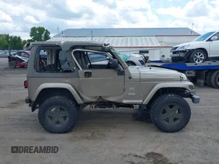 2004 Jeep Wrangler Sahara with VIN 1J4FA59S54P740417, listed as a IAAI auction lot 42382078 with 200,108 mi miles and . Bid and sale history available at DreamBid. Image 14.