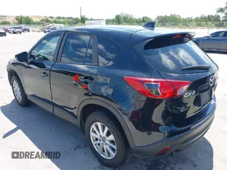 2014 Mazda CX-5 Sport with VIN JM3KE2BE9E0402015, listed as a IAAI auction lot 42098197 with 65,328 mi miles and . Bid and sale history available at carsss.com. Image 3.