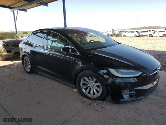 2017 Tesla Model X P100D with VIN 5YJXCDE42HF052851, listed as a Copart auction lot 75763854 with NaN miles and Salvage Title. Bid and sale history available at carsss.com. Image 4.