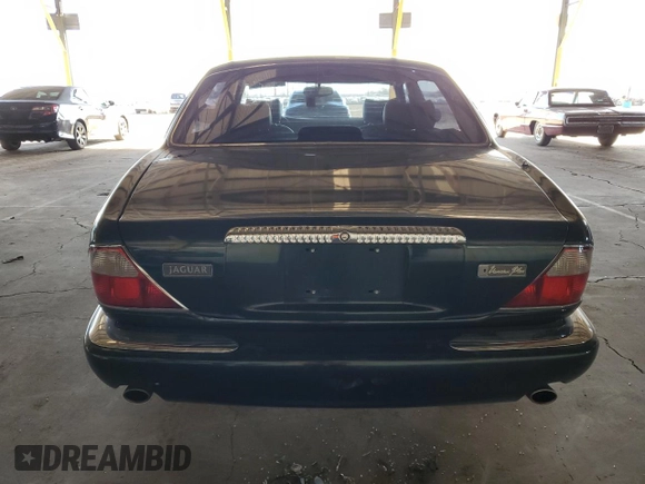 1999 Jaguar XJ with VIN SAJKX6046XC855872, listed as a Copart auction lot 47060465 with 65,286 mi miles and Clean title. Bid and sale history available at DreamBid. Image 6.