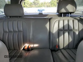 1999 Jeep Grand Cherokee Limited with VIN 1J4G268S7XC668348, listed as a Copart auction lot 77824084 with 165,779 mi miles and Salvage title. Bid and sale history available at DreamBid. Image 10.