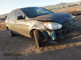2011 Hyundai Accent GLS with VIN KMHCN4AC7BU610676, listed as a IAAI auction lot 42051520 with 165,902 mi miles. Bid and sale history available at carsss.com. Image 1.